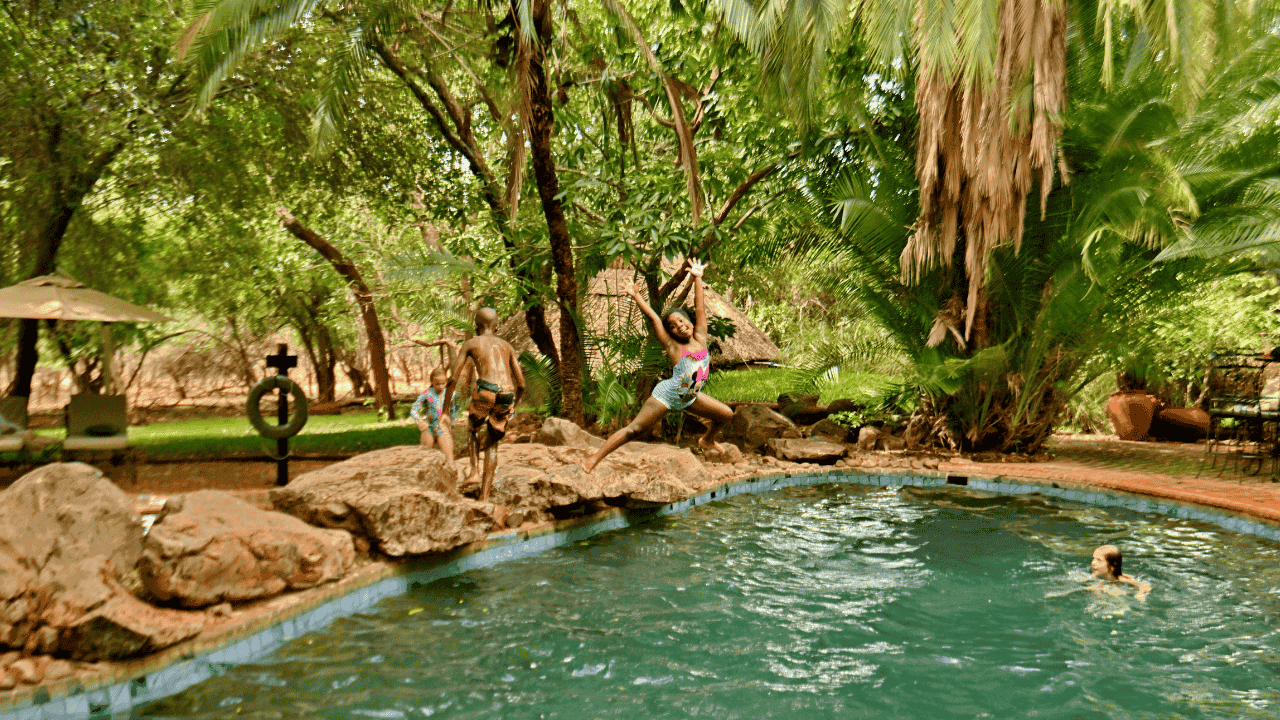 Kids swimming and playing in the pool