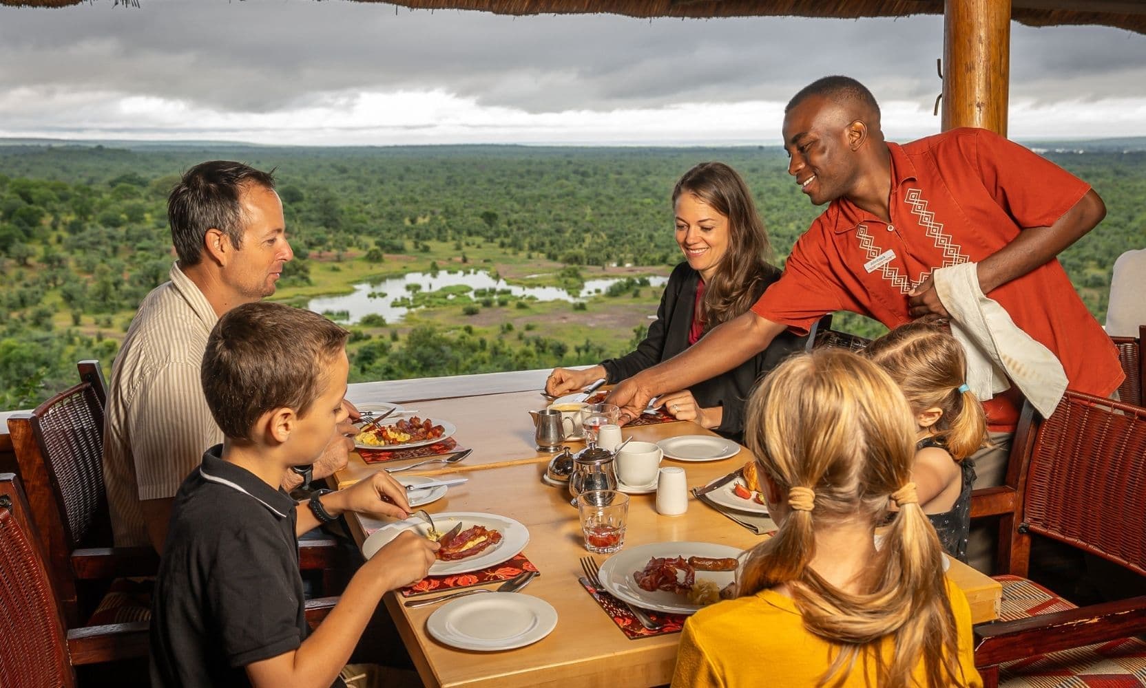 A family enjoying a meal at Makuwa-Kuwa