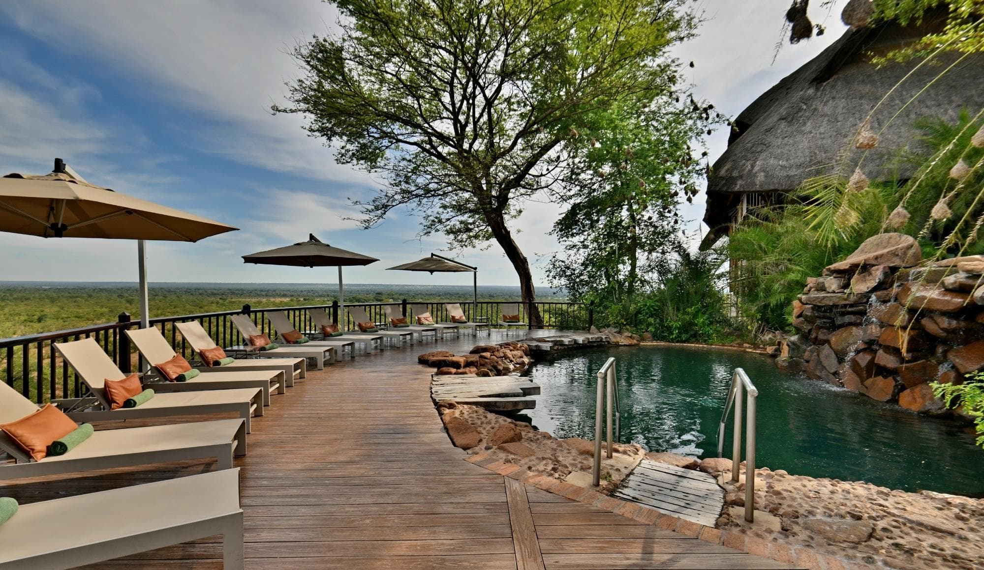 Swimming pool with sun deck and loungers