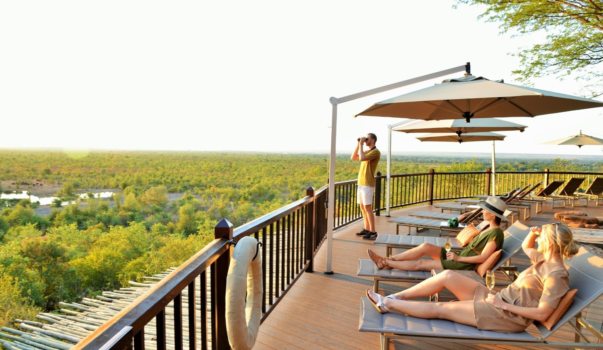Guests enjoying the view at the Victoria Falls Safari Lodge pool